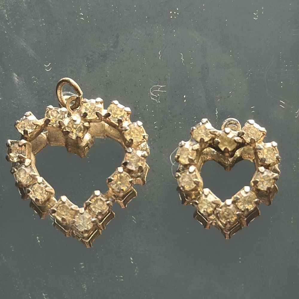 Two vintage rhinestone heart pendants